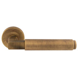 This is an image of a Carlisle Brass - Masano Lever On Rose - Antique Brass that is availble to order from Trade Door Handles in Kendal.