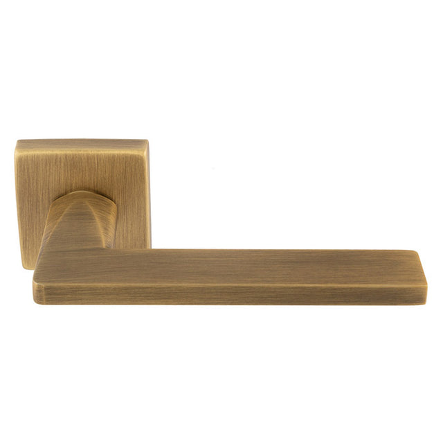 This is an image of a Carlisle Brass - Volta Lever On Concealed Fix Push-On Square Rose - Antique Brass eul110ab that is availble to order from Trade Door Handles in Kendal.