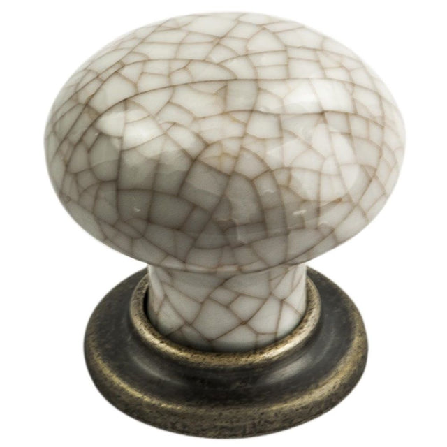 This is an image of a FTD - Porcelain Mushroom Pattern Knob 35mm - Antique Brass Ivory Crackle Glaze  that is availble to order from Trade Door Handles in Kendal.