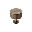 This is an image of a Carlisle Brass - Lines Radio Knob - Antique Brass that is availble to order from Trade Door Handles in Kendal.