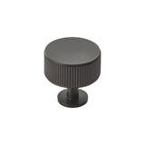 This is an image of a Carlisle Brass - Lines Radio Knob - Matt Black that is availble to order from Trade Door Handles in Kendal.