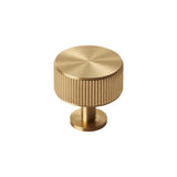 This is an image of a Carlisle Brass - Lines Radio Knob Satin Brass that is availble to order from Trade Door Handles in Kendal.