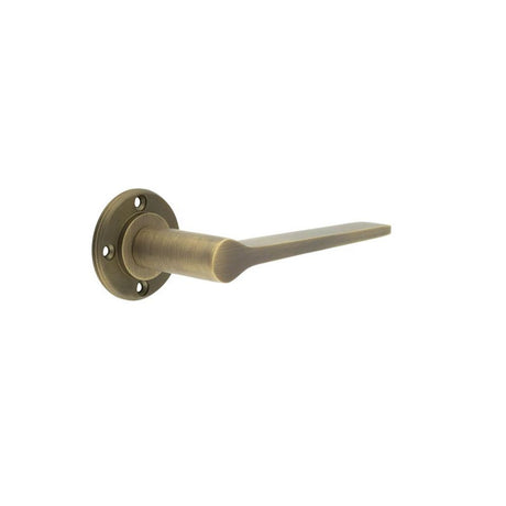 This is an image of a Burlington - Knightsbridge lever on rose - Antique Brass  that is availble to order from Trade Door Handles in Kendal.