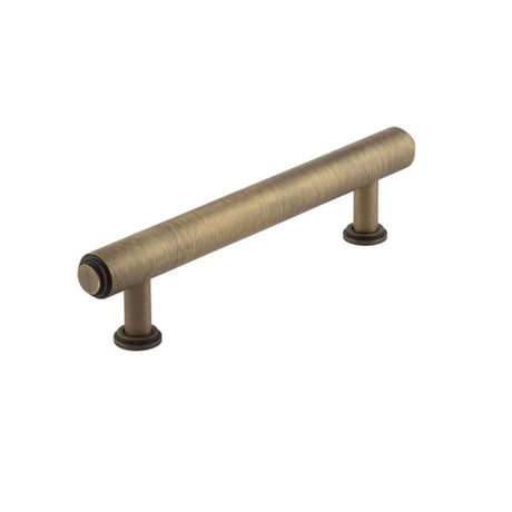 This is an image of a Burlington - Belgrave Cabinet Handle 128mm CTC - Antique Brass  that is availble to order from Trade Door Handles in Kendal.