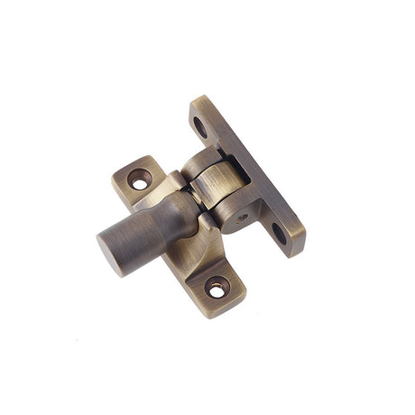 This is an image of a Burlington - sash fastener - Antique Brass  that is availble to order from Trade Door Handles in Kendal.