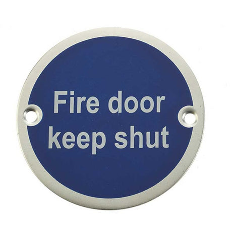 This is an image of a Frelan - Fire Door Keep Shut' - Signage 75mm Dia. - Satin Anodised Aluminium that is availble to order from Trade Door Handles in Kendal.