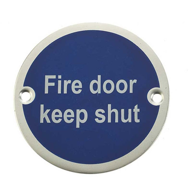 This is an image of a Frelan - Fire Door Keep Shut' - Signage 75mm Dia. - Satin Anodised Aluminium  that is availble to order from Trade Door Handles in Kendal.