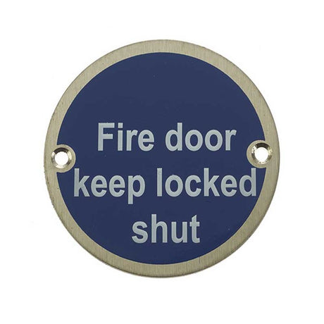 This is an image of a Frelan - Fire Door Keep Locked Shut - Signage 75mm Dia. - Satin Stainless Steel  that is availble to order from Trade Door Handles in Kendal.