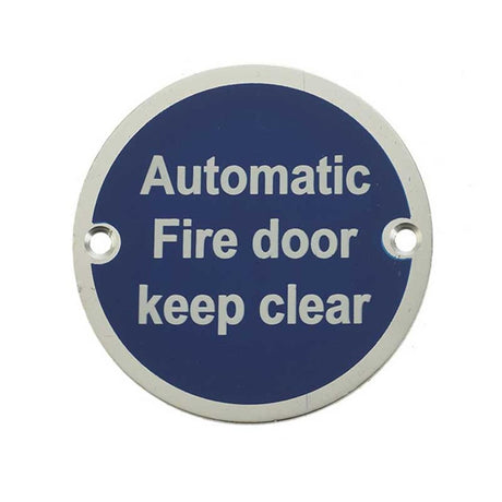 This is an image of a Frelan - Automatic Fire Door Keep Clear - Signage 75mm Dia. - Satin Anodised Alu  that is availble to order from Trade Door Handles in Kendal.