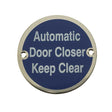 This is an image of a Frelan - Automatic Door Closer Keep Clear - Signage 75mm Dia. - Polished Stainle  that is availble to order from Trade Door Handles in Kendal.