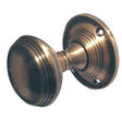 This is an image of a Frelan - Lined Unsprung Mortice Knobs  - Antique Brass  that is availble to order from Trade Door Handles in Kendal.