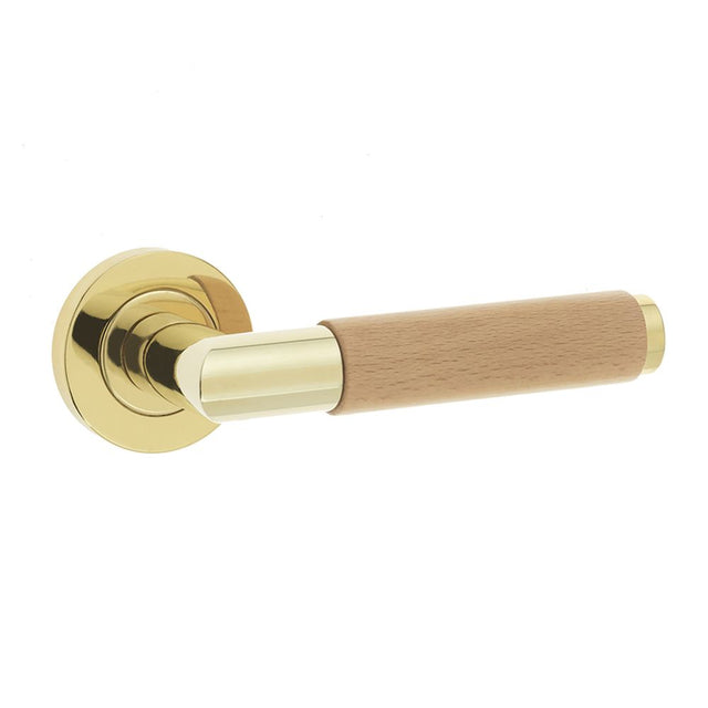 This is an image of a Frelan - Havanna Levers on Round Rose - Polished Brass  that is availble to order from Trade Door Handles in Kendal.