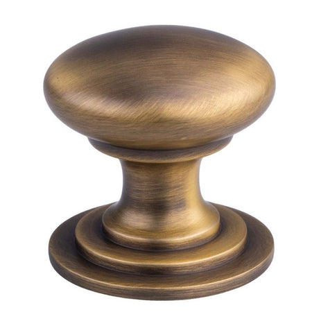 This is an image of a FTD - Victorian Cupboard Knob 32mm - Antique Brass that is availble to order from Trade Door Handles in Kendal.