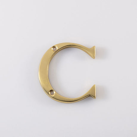 This is an image of a Carlisle Brass - Letter C - Polished Brass that is availble to order from Trade Door Handles in Kendal.