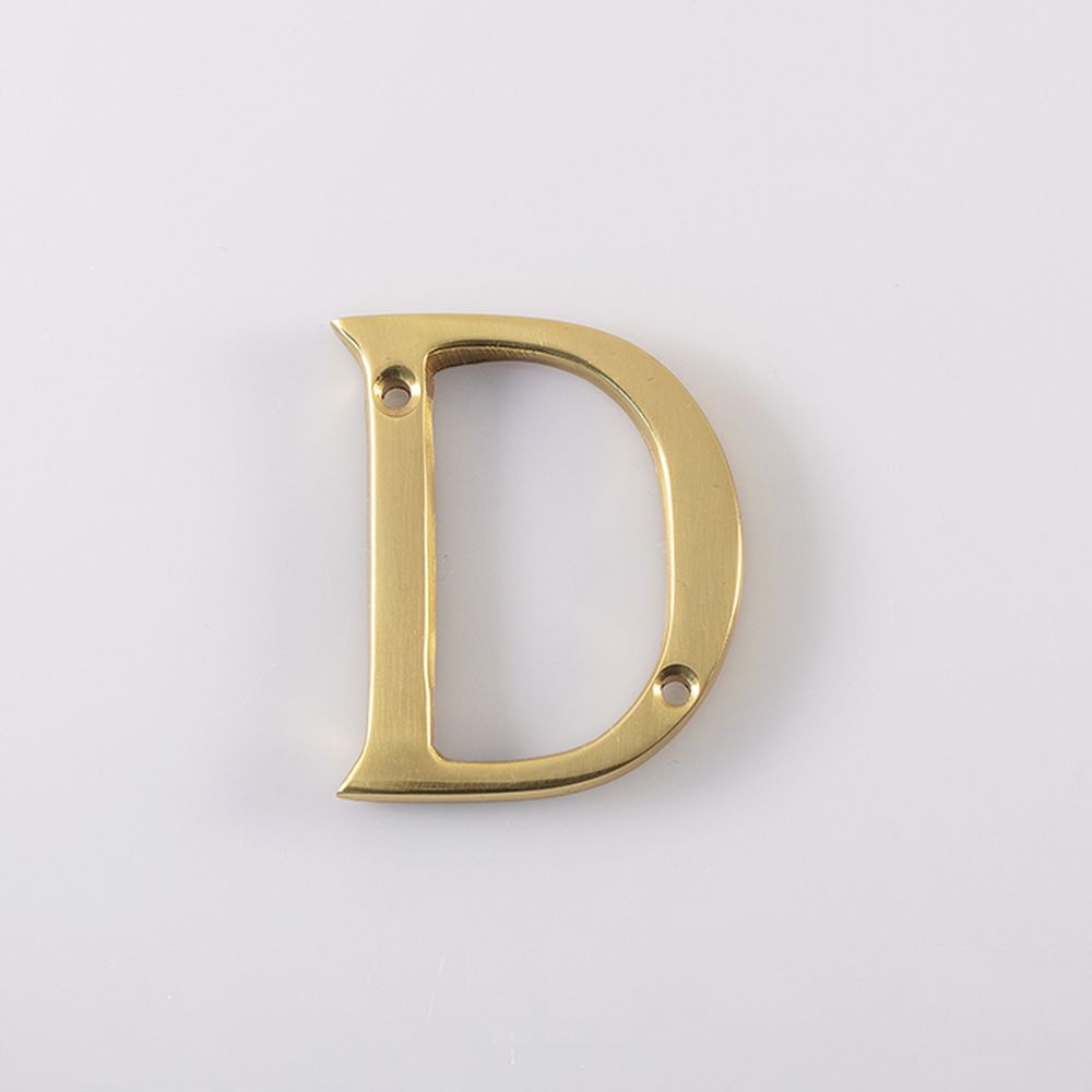 This is an image of a Carlisle Brass - Letter D - Polished Brass that is availble to order from Trade Door Handles in Kendal.