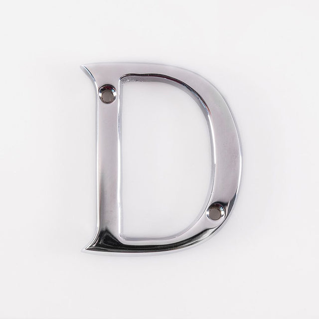 This is an image of a Carlisle Brass - Letter D - Polished Chrome that is availble to order from Trade Door Handles in Kendal.