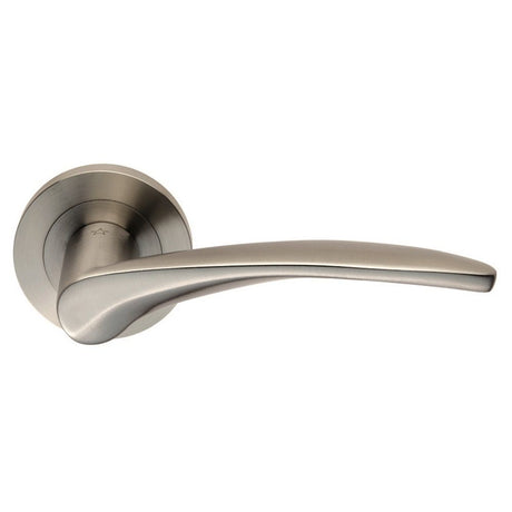 This is an image of a Eurospec - Steelworx SWL Tirolo Lever on Rose - Satin Stainless Steel that is availble to order from Trade Door Handles in Kendal.