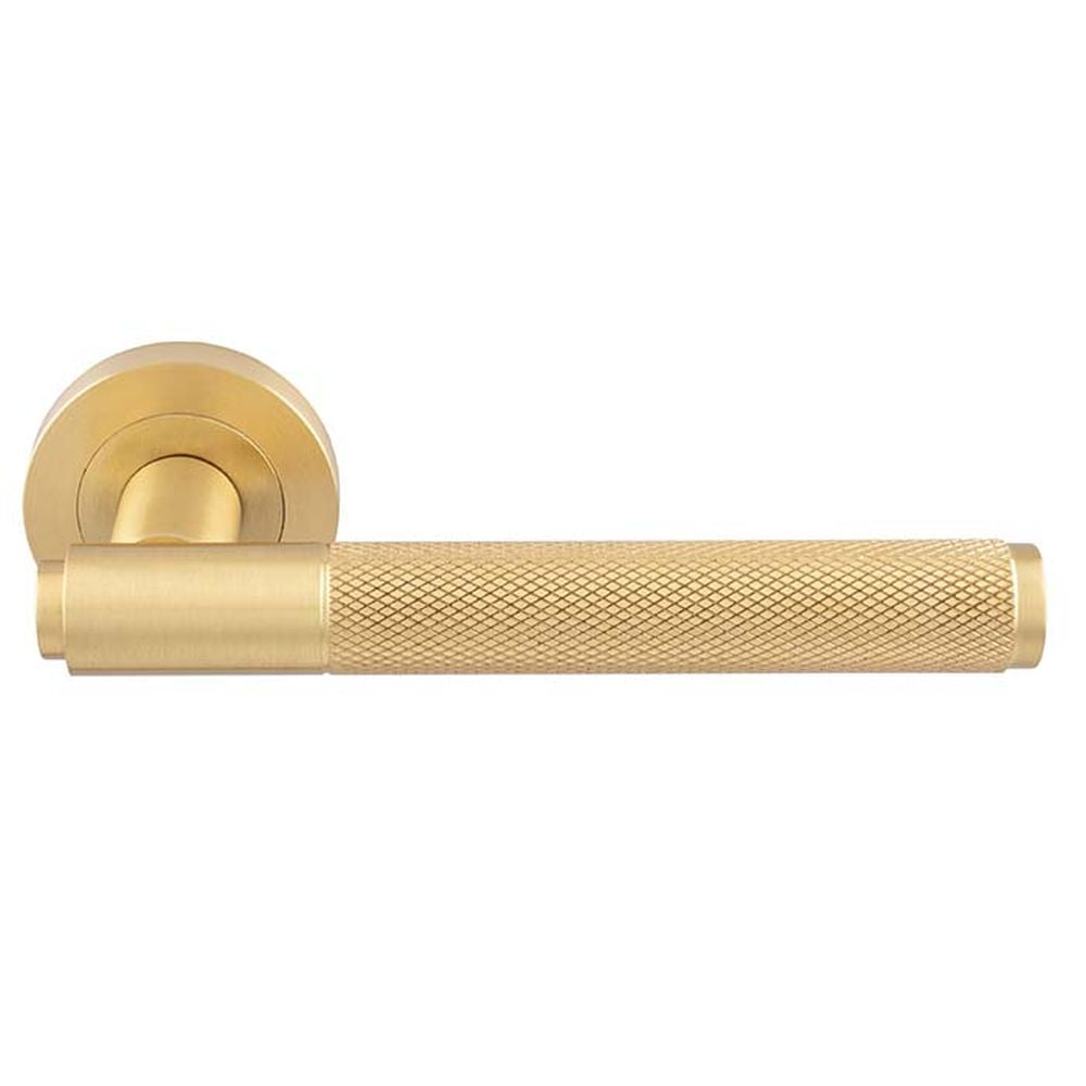 This is an image of a Manital - Syntax Lever On round Rose - Satin Brass that is availble to order from Trade Door Handles in Kendal.