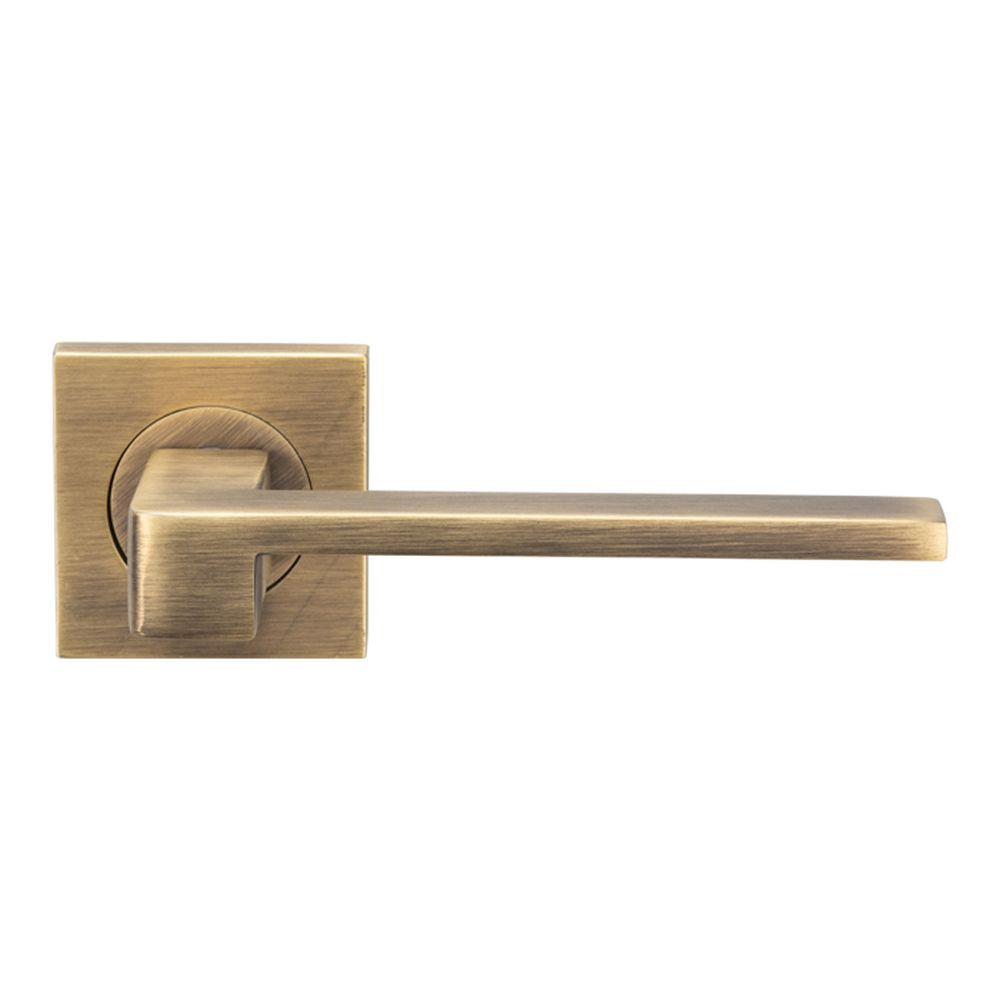 This is an image of a Serozzetta - Equi Lever on Square Rose - Antique Brass that is availble to order from Trade Door Handles in Kendal.