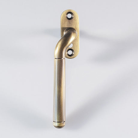 High quality image of Carlisle Brass - Cranked Locking Espagnolette Handle L/H - Florentine Bronze | Sku. v1008lhfb | Trade Door Handles, Kendal.