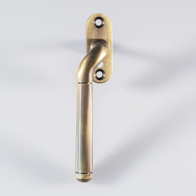 High quality image of Carlisle Brass - Cranked Locking Espagnolette Handle L/H - Florentine Bronze | Sku. v1008lhfb | Trade Door Handles, Kendal.
